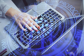 Multi exposure of woman hands working on computer and data theme hologram drawing. Tech concept.