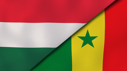 The flags of Hungary and Senegal. News, reportage, business background. 3d illustration © Maksym Kapliuk