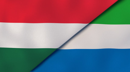 The flags of Hungary and Sierra Leone. News, reportage, business background. 3d illustration