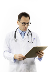 Shocked senior age doctor in white lab coat and stethoscope looking on clipboard with patient's medical diagnosis on isolated white background. Health, healthcare, insurance and medical concept