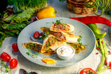 Traditional Mexican Food - Burrito, on white wooden retro table
