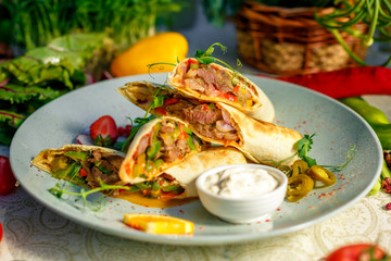 Traditional Mexican Food - Burrito, on white wooden retro table