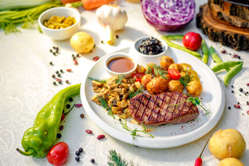 delicious steak with mushrooms and baked potatoes with jalapeno, healthy food