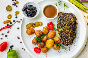 Pepper Steak with Baked Potatoes Pickled Onion and Vegetable Sauce