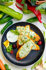 appetizing garlic bread with cheese and fresh vegetables