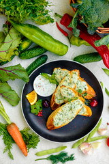 appetizing garlic bread with cheese and fresh vegetables