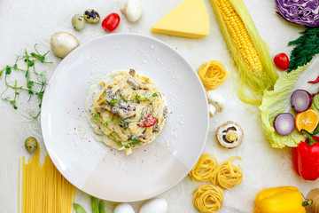 Spaghetti Carbonara - pasta with smoked bacon and mushrooms in creamy sauce and Parmesan cheese