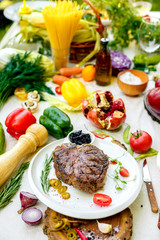 juicy barbecue steak with pickled onions and jalapeno on a white plate