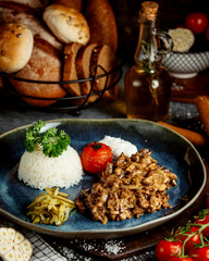 fried meat with mushrooms and rice