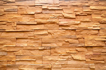 Rugged brown piled stone wall