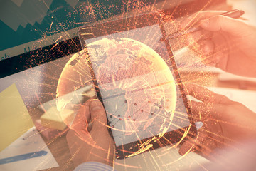 Double exposure of man's hands holding and using a phone and social network theme drawing.