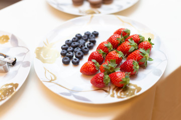 Blueberries and strawberries on a plate