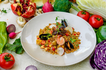 ice risotto with seafood, mussels, shrimps and vegetables, healthy food