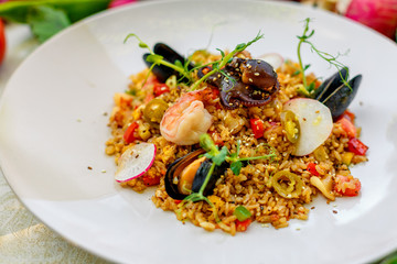ice risotto with seafood, mussels, shrimps and vegetables, healthy food