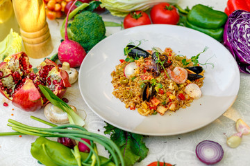 ice risotto with seafood, mussels, shrimps and vegetables, healthy food