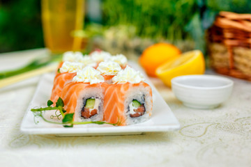 Sushi Philadelphia with soy sauce and chopsticks