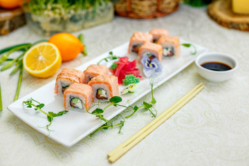 sushi with wasabi and soy sauce with chopsticks