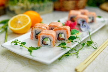 sushi with wasabi and soy sauce with chopsticks