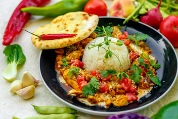 Mexican food, fajitos with vegetables, wheat cake and hot pepper on the table decorated with vegetables