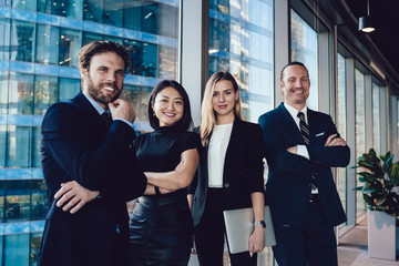 Obraz premium Half length portrait of cheerful male and female managers crew enjoying cooperation and successful career, cheerful 30s woman and man business partners in formal wear looking at camera smiling