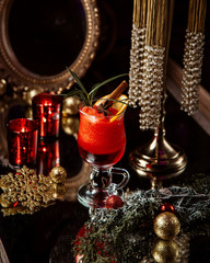 fruit juice with lemon slice and cinnamon