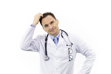 Middle-aged handsome doctor in white coat and stethoscope looking unhappy and frustrated scratches head with his hand, isolated white background, making decision concept