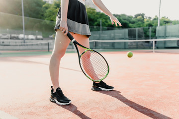 Fototapeta na wymiar woman tennis player with racket and ball on court