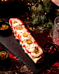 lavash doner topped with melted cheese and tomato