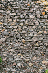 Vintage Texture of old gray stone wall, vertical