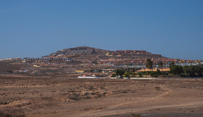 Buildings on the mountain in caleta de Fuste on Fuertaventura , Canary Island, Spain. October 2019