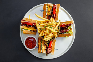 club sandwich with french fries and ketchup