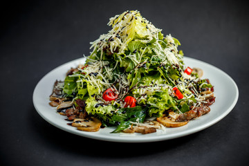 salad with mushrooms, tomatoes and meat