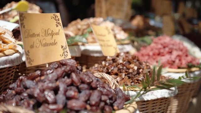 Amazing colorful market counter with variety of healthy dried fruits in round deep baskets. Dried fruit full of vitamins and minerals, healthy nutrition for human body