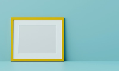 Blank picture frame mock up on the blue wall. 3d rendering.