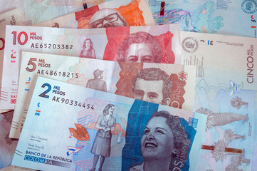 Composition with various Colombian banknotes. Paper money, cash. Two thousand Colombian pesos banknote. Current money.
