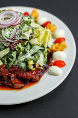Mix of five types of lettuce (iceberg, batavia, spinach, arugula, lollo rossa) and crispy cucumbers in a dressing from Greek yogurt