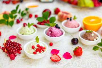 ice cream with fruits and different flavors (pistachio, chocolate, vanilla, cream)