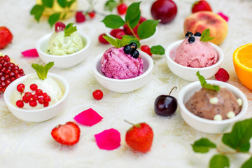 ice cream with fruits and different flavors (pistachio, chocolate, vanilla, cream)