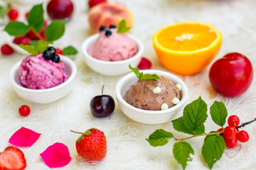 ice cream with fruits and different flavors (pistachio, chocolate, vanilla, cream)