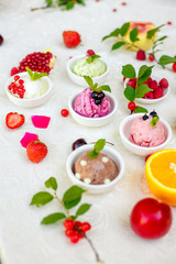 ice cream with fruits and different flavors (pistachio, chocolate, vanilla, cream)