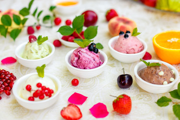 ice cream with fruits and different flavors (pistachio, chocolate, vanilla, cream)