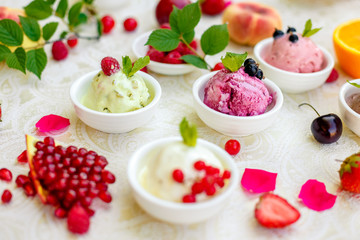 ice cream with fruits and different flavors (pistachio, chocolate, vanilla, cream)
