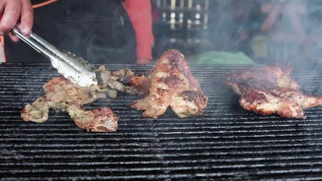Cooking meat on grill close up shot in mountains of ecuador