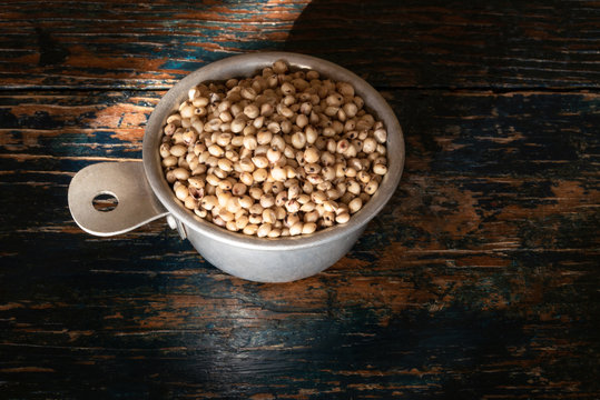 Sorghum Seeds in a Measuring Cup
