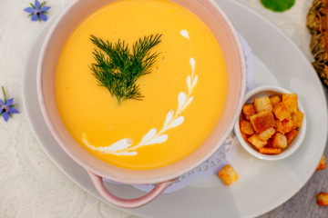 cheese soup with crackers on the holiday table