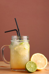 lime and lemon cocktail. non alcoholic citrus summer drinks with citrus on wooden table. Deliciouse nature summer refreshing drink in glass.