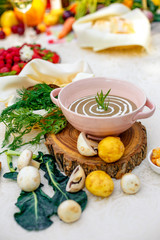 mushroom soup with vegetables and herbs on the table
