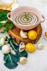 mushroom soup with vegetables and herbs on the table