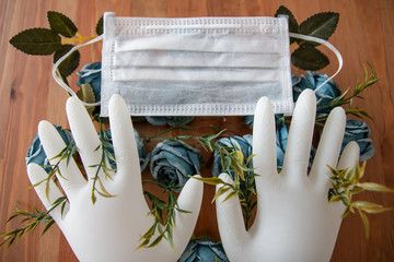 flowers blooming through white gloves