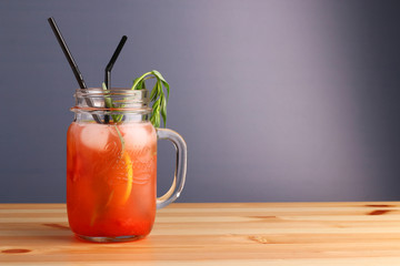 berry and citrus cocktail. non alcoholic summer drinks with citrus on wooden table. Deliciouse nature summer refreshing drink in glass.